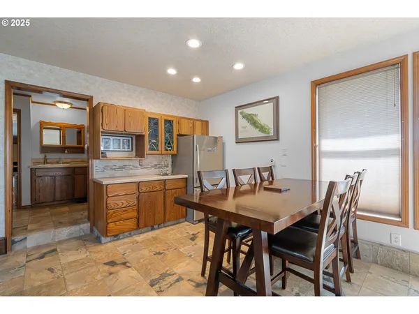 a kitchen with a table and chairs in it