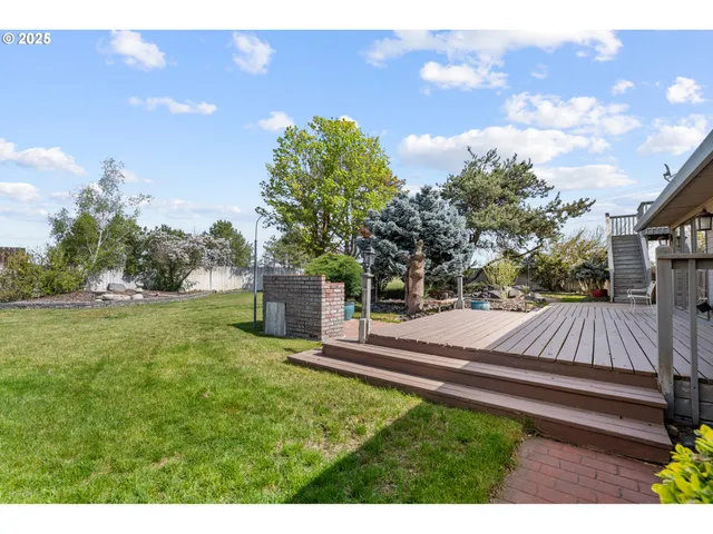 a view of a backyard with sitting area