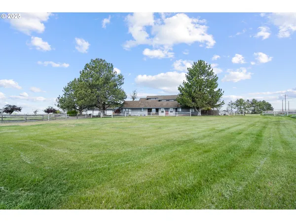 a view of yard with outdoor seating and green space