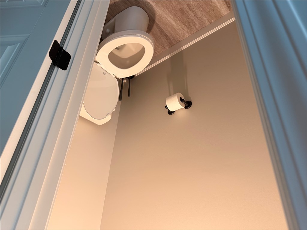 166 Pheasant Ridge Drive Anderson, SC 29626 - Photo 12 of 13 A classic water closet features neutral walls and wood-look flooring.