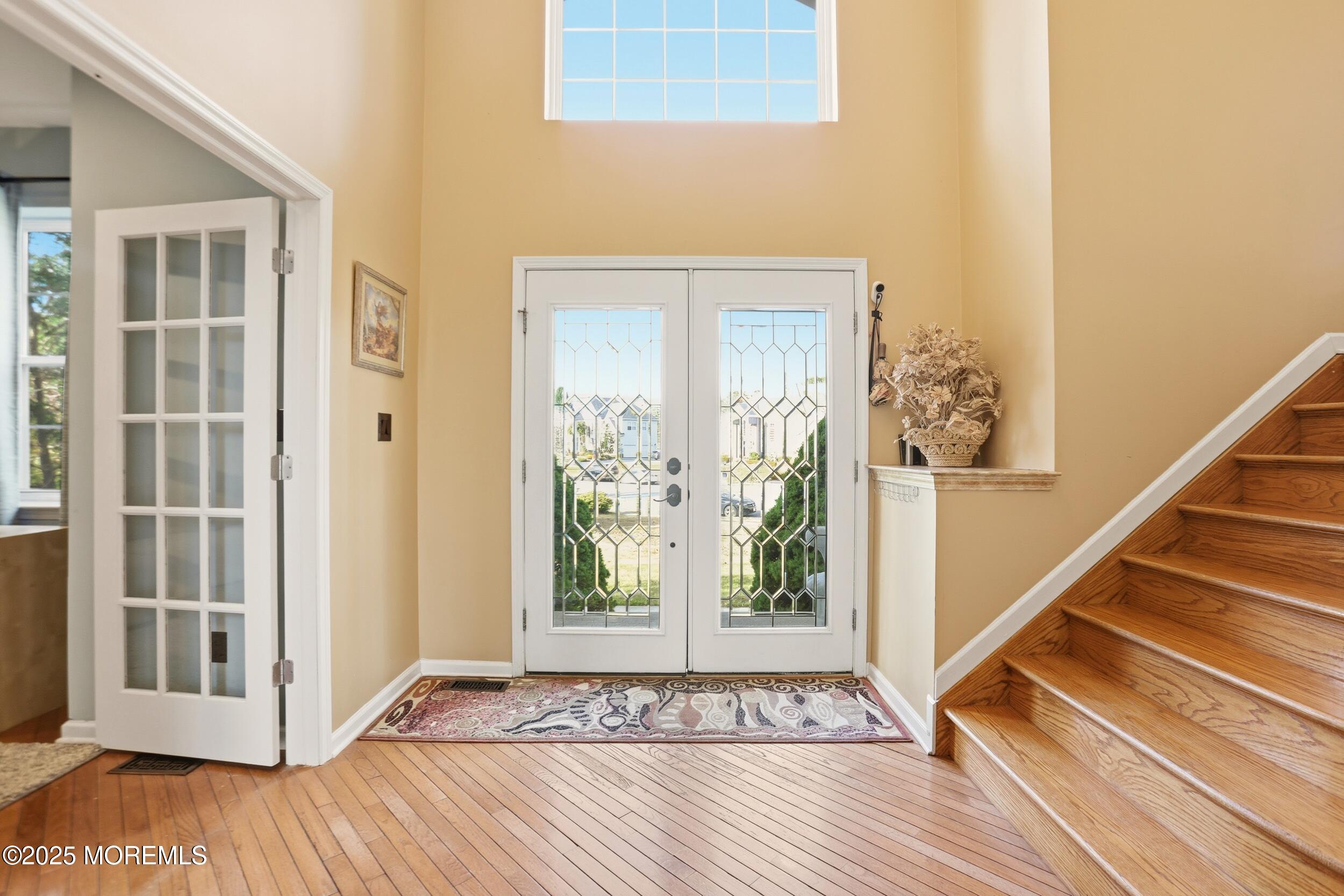 2 Woods Edge Drive Jackson, NJ 08527 - Photo 4 of 43 a view of a entryway with wooden floor and stairs