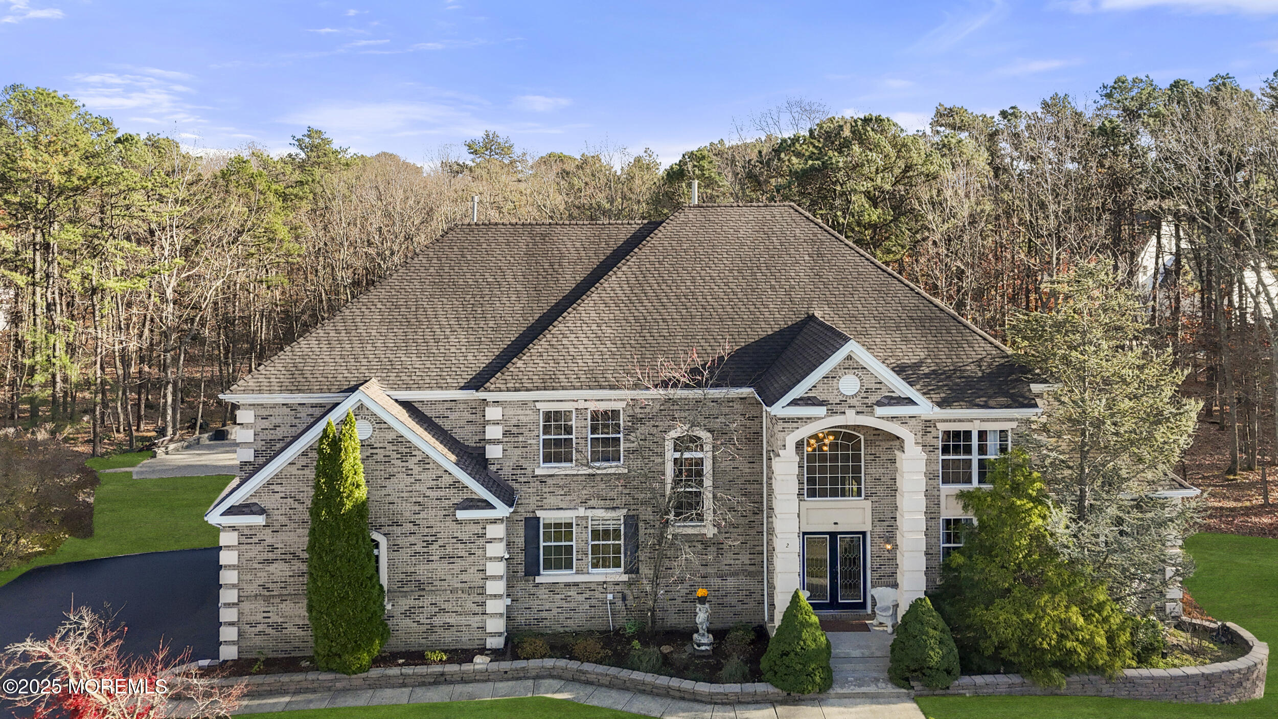 2 Woods Edge Drive Jackson, NJ 08527 - Photo 5 of 43 a front view of a house with a yard