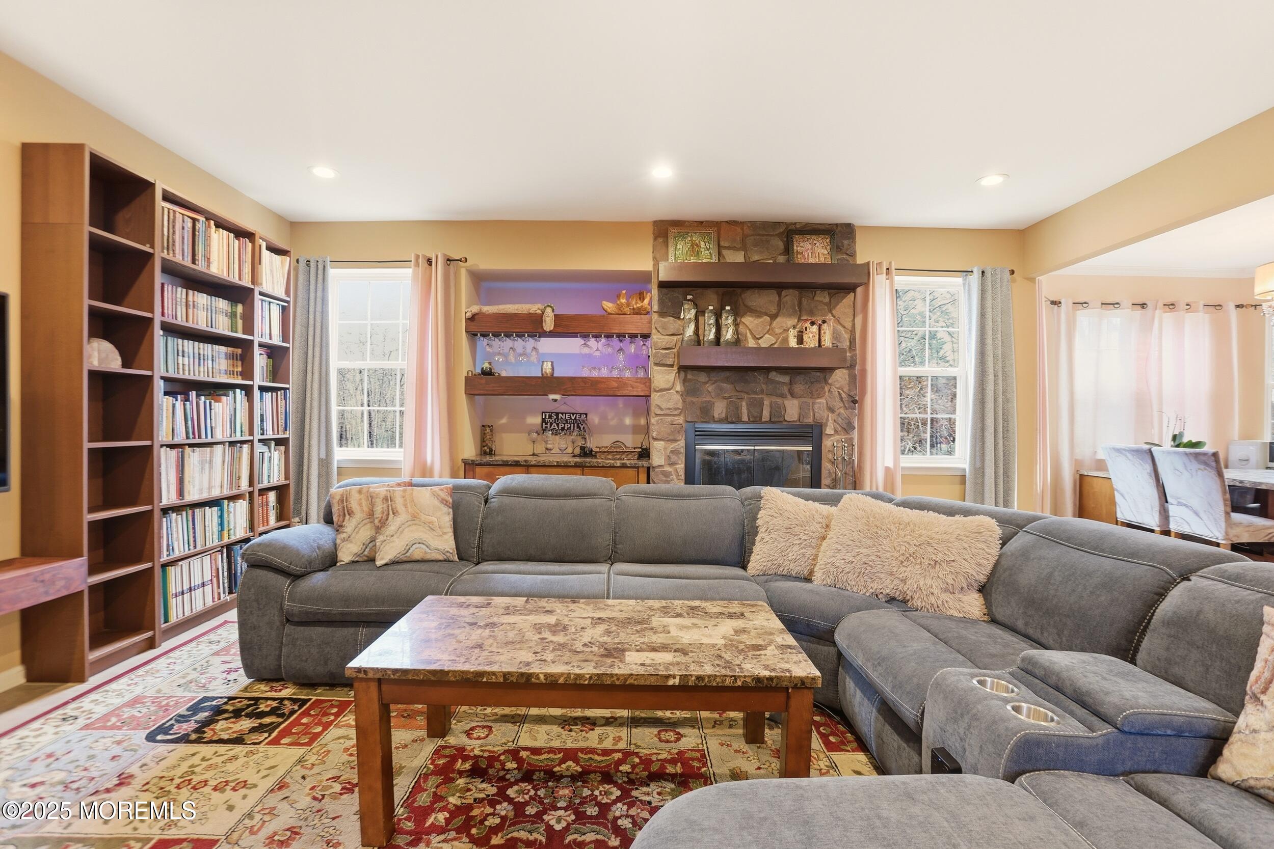 2 Woods Edge Drive Jackson, NJ 08527 - Photo 7 of 43 a living room with furniture and a fireplace