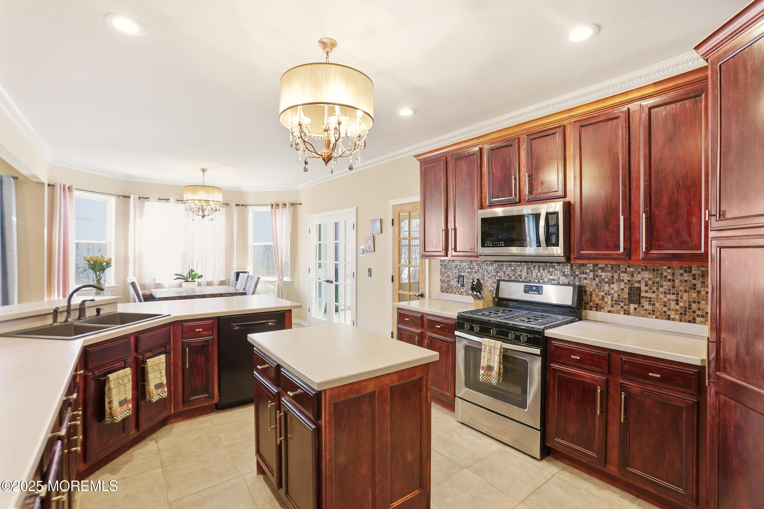 2 Woods Edge Drive Jackson, NJ 08527 - Photo 8 of 43 a kitchen with a stove a sink a microwave and wooden cabinets