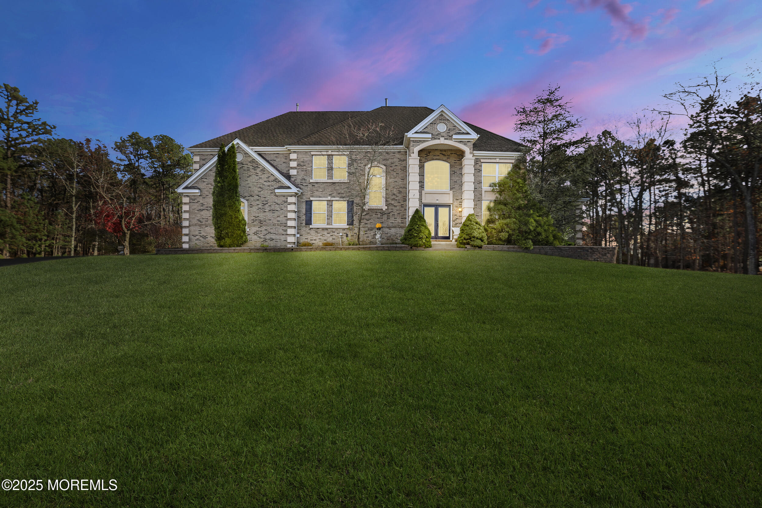 2 Woods Edge Drive Jackson, NJ 08527 - Photo 10 of 43 a front view of a house with a garden