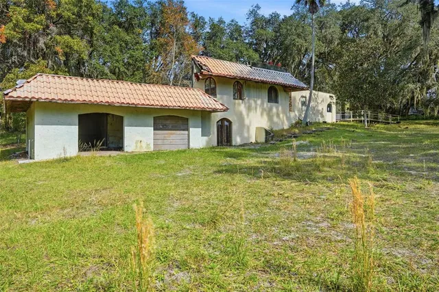a view of a wooden house with a outdoor space
