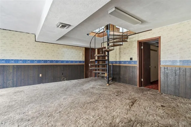 a kitchen with stainless steel appliances granite countertop a sink and cabinets
