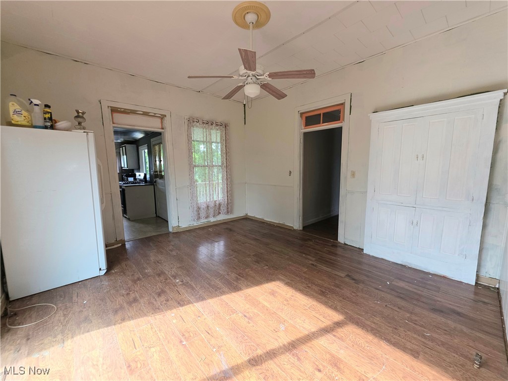 10 Browns Ridge Road Rockport, WV 26169 - Photo 9 of 35 Unfurnished bedroom featuring freestanding refrigerator and wood finished floors