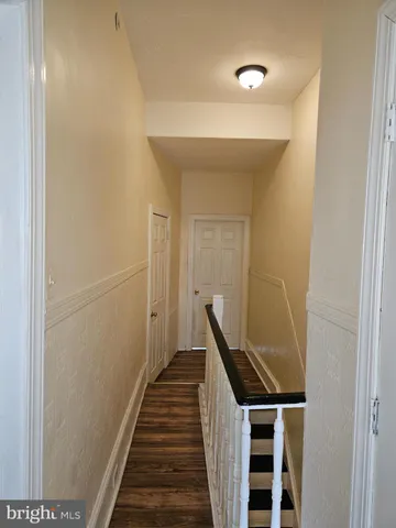 a view of a hallway with stairs