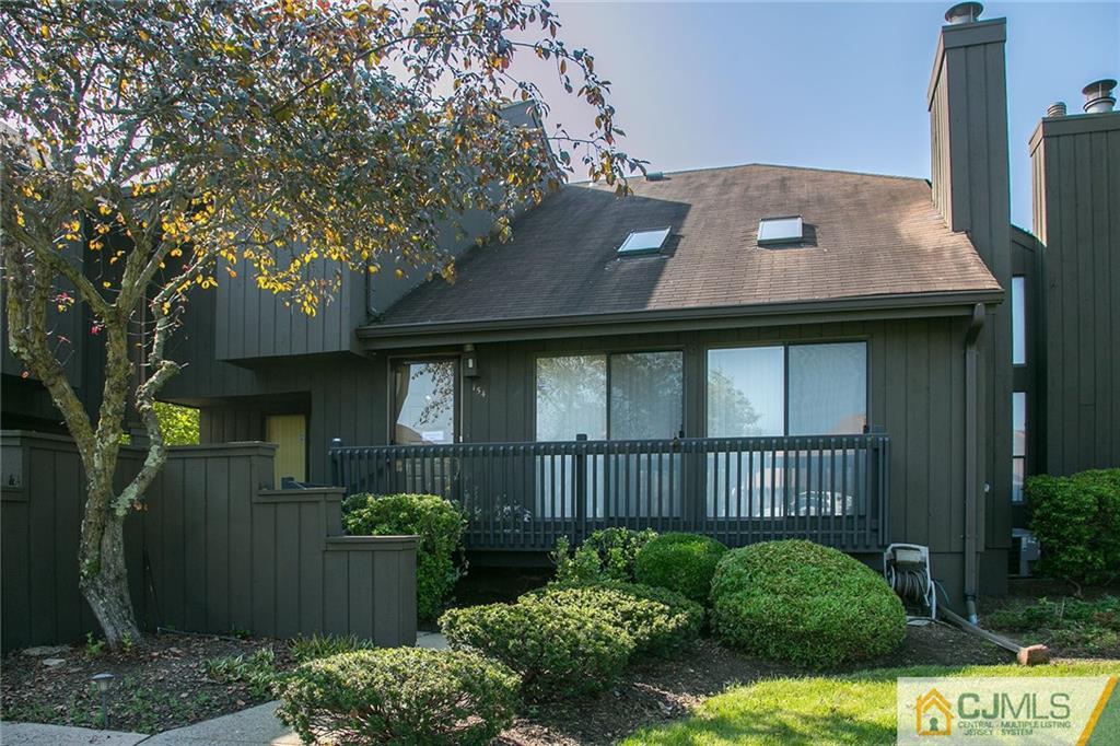 154 Westgate Drive Edison, NJ 08820 - Photo 1 of 19 a view of a house with brick walls and flower plants