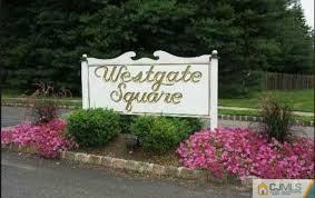 154 Westgate Drive Edison, NJ 08820 - Photo 2 of 19 a sign on the side of the road