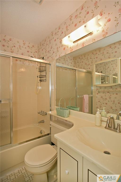 154 Westgate Drive Edison, NJ 08820 - Photo 18 of 19 a bathroom with a sink a toilet and shower