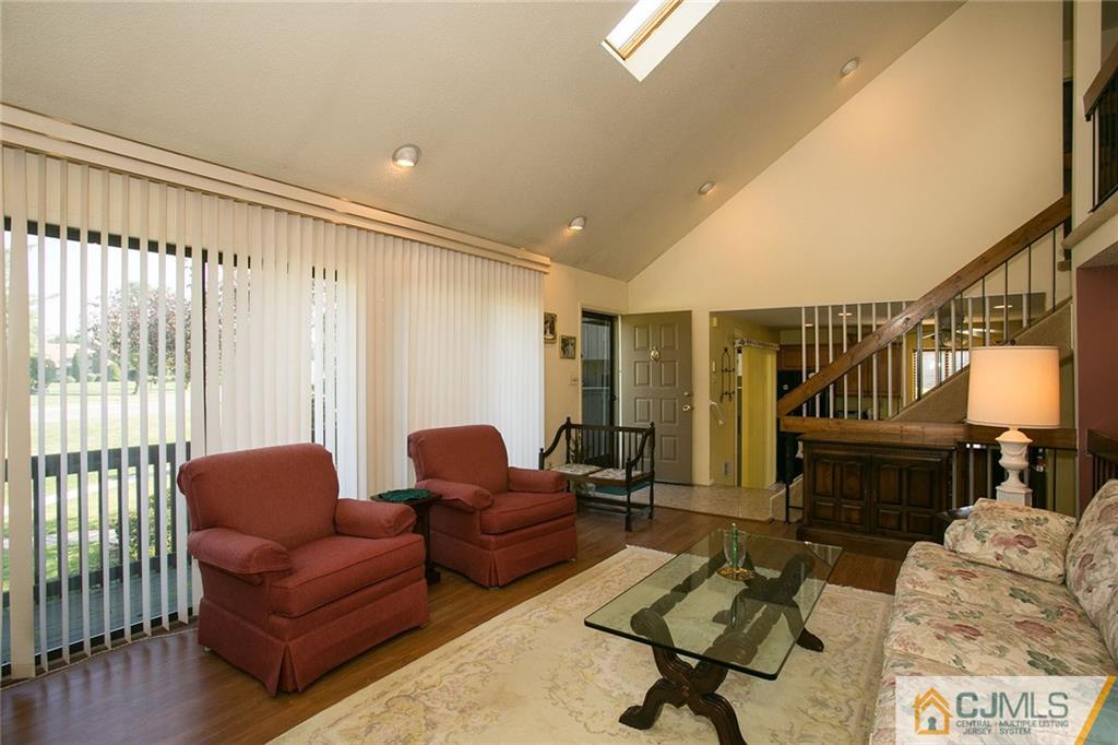 154 Westgate Drive Edison, NJ 08820 - Photo 4 of 19 a living room with furniture and a rug