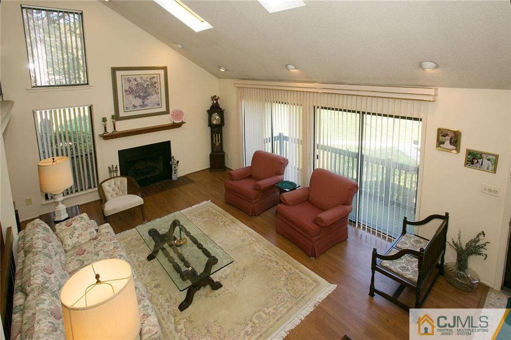 154 Westgate Drive Edison, NJ 08820 - Photo 5 of 19 a living room with furniture fireplace and a flat screen tv