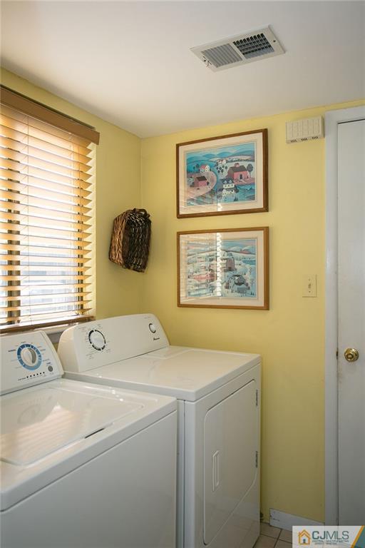 154 Westgate Drive Edison, NJ 08820 - Photo 10 of 19 a utility room with dryer and washer