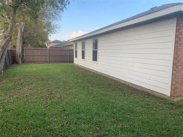 a view of a backyard with a garden