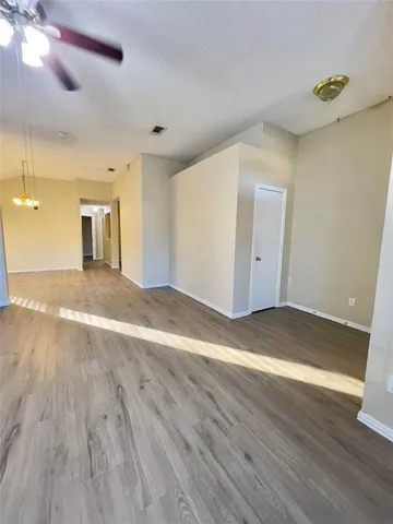 a view of a livingroom with wooden floor