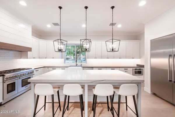 a view of a house with a yard patio and a slide