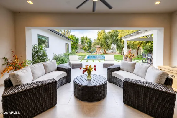 a front view of house with yard and outdoor seating