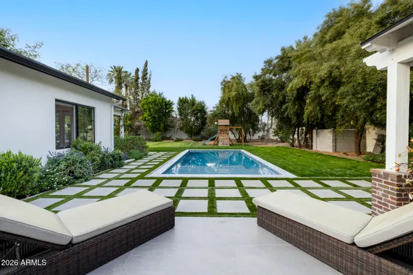 a view of a house with a yard porch and sitting area