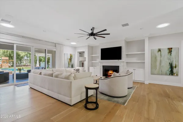 a living room with furniture and a potted plant