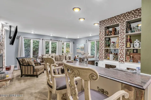 a very nice looking living room with a large window and furniture