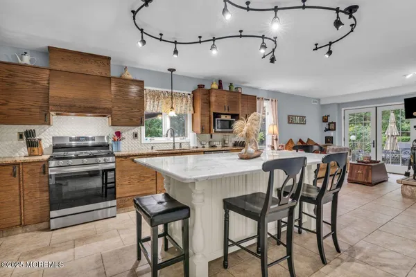 a kitchen with a sink stove and cabinets