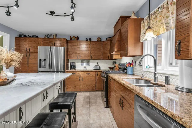 a view of a livingroom with furniture and a mirror