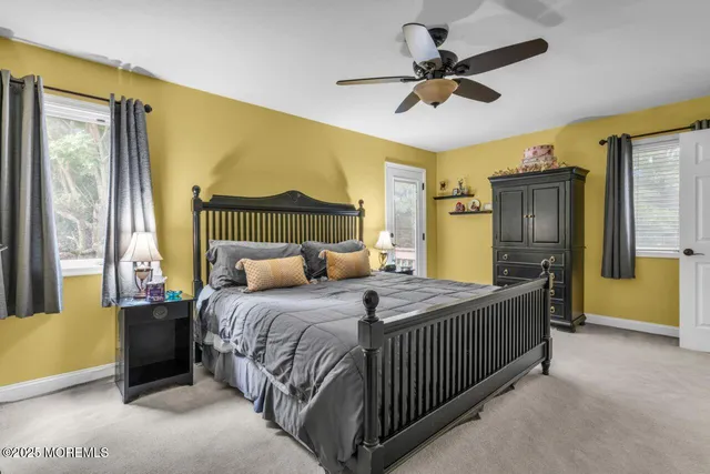 a living room with furniture pool table table and flat screen tv