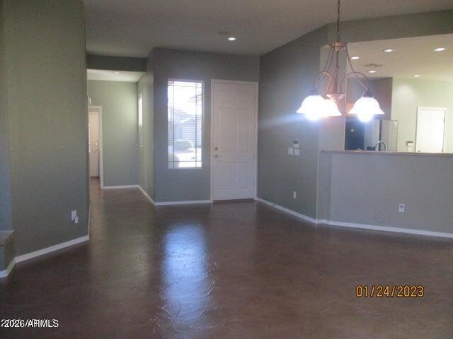 10164 185th Avenue Goodyear, AZ 85338 - Photo 3 of 8 a view of a room with wooden floor and windows