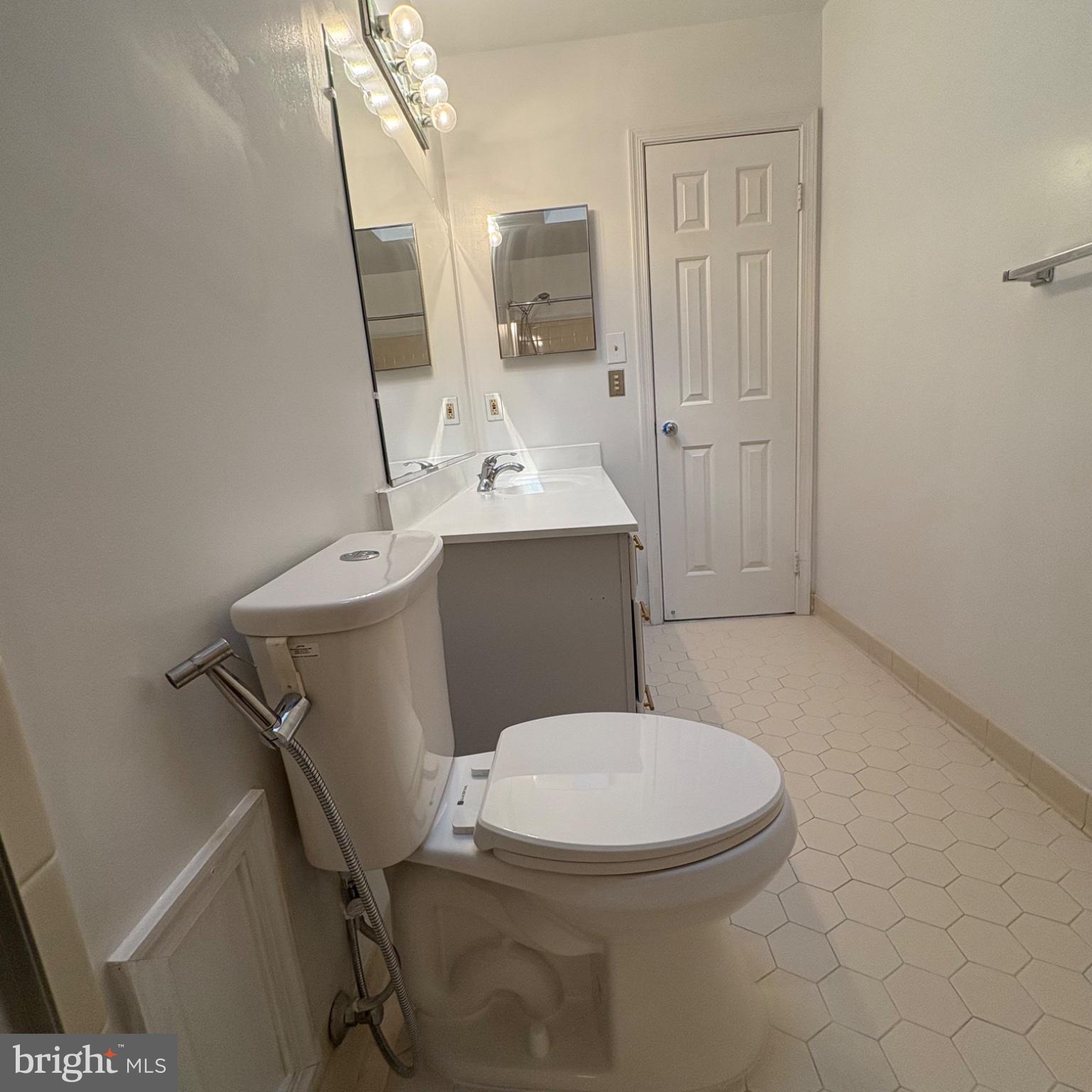 3502 Holly Road Annandale, VA 22003 - Photo 41 of 57 a white toilet sitting next to a bathroom sink