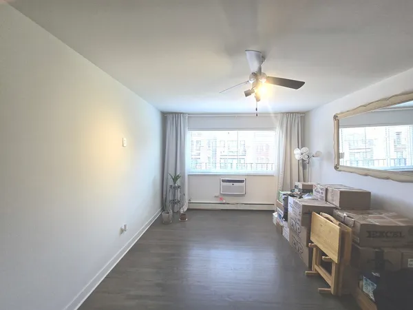 a view of an empty room with a window