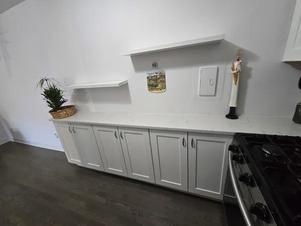 a kitchen with a sink and cabinets