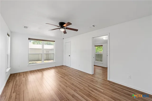 an aerial view of a houses with a lake view
