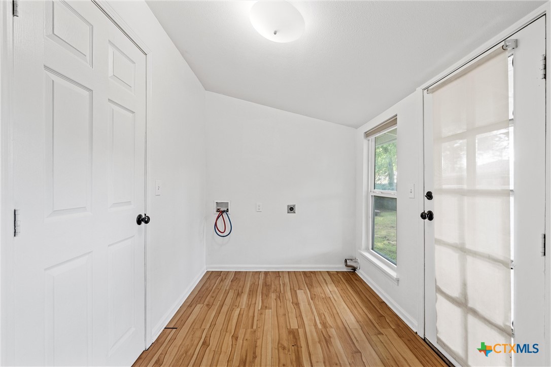 407 East 7th Street Cameron, TX 76520 - Photo 30 of 43 a view of a room with wooden floor closet and windows
