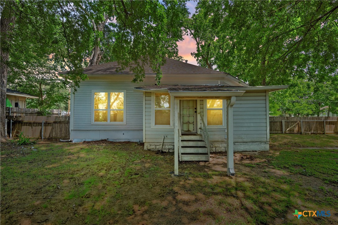 407 East 7th Street Cameron, TX 76520 - Photo 31 of 43 a front view of a house with a yard