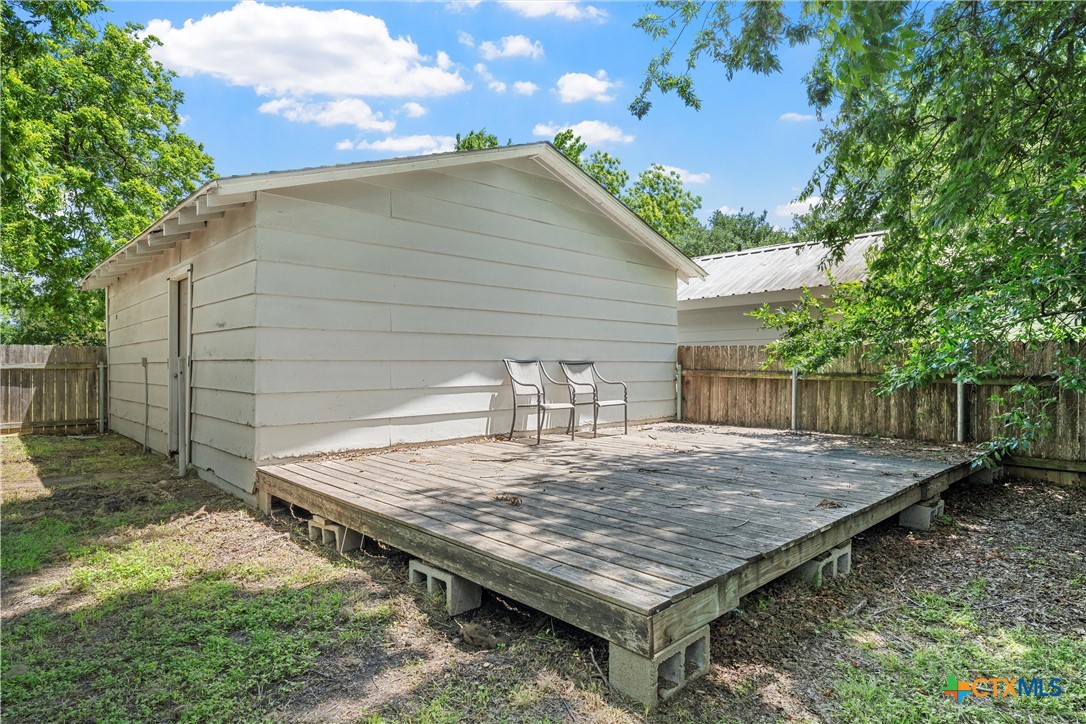 407 East 7th Street Cameron, TX 76520 - Photo 34 of 43 a view of a wooden floor with a wooden fence
