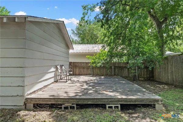 a view of a wooden fence