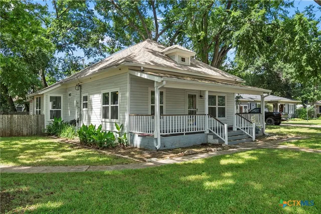 front view of a house with a small yard