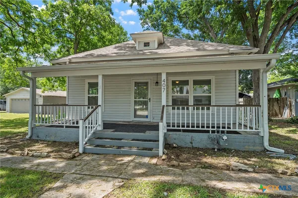 front view of a house with a small yard