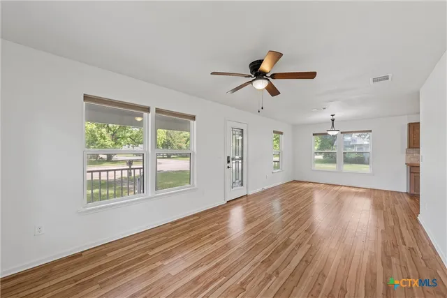 a kitchen with stainless steel appliances granite countertop a sink a cabinets and window