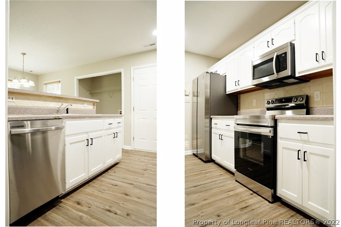 2940 Bakers Mill Road Fayetteville, NC 28306 - Photo 12 of 46 a kitchen with stainless steel appliances a white stove top oven and sink