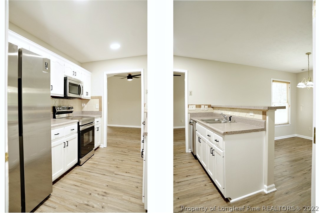 2940 Bakers Mill Road Fayetteville, NC 28306 - Photo 13 of 46 a kitchen with granite countertop a stove top oven and refrigerator