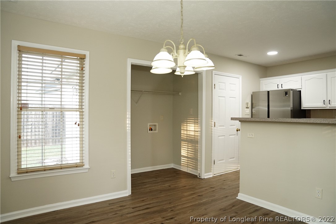2940 Bakers Mill Road Fayetteville, NC 28306 - Photo 17 of 46 a view of a livingroom with a chandelier