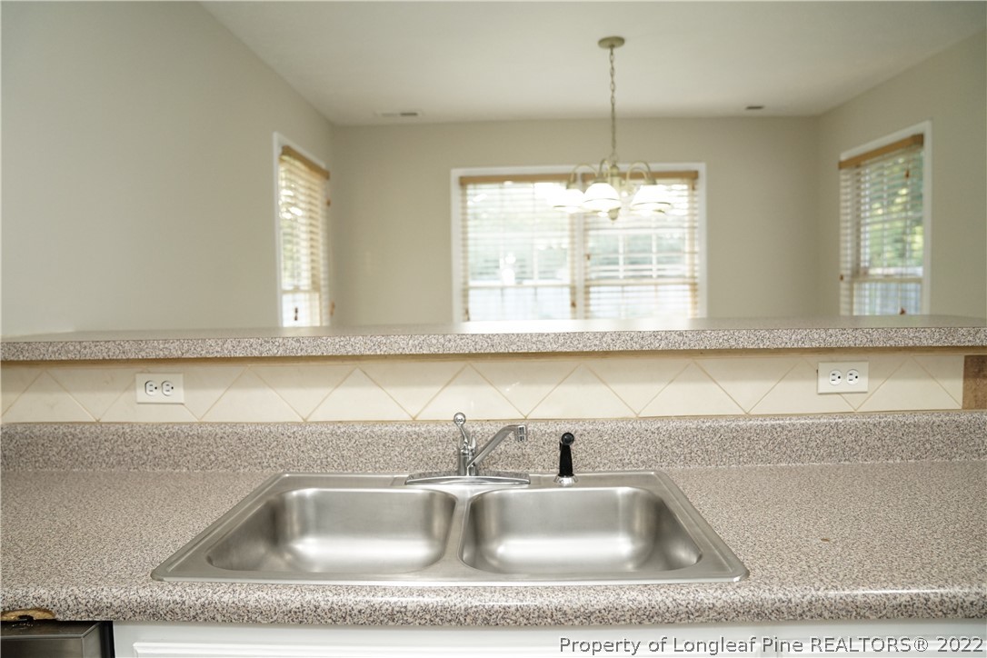 2940 Bakers Mill Road Fayetteville, NC 28306 - Photo 19 of 46 a close view of sink a faucet a faucet cabinets and a couch