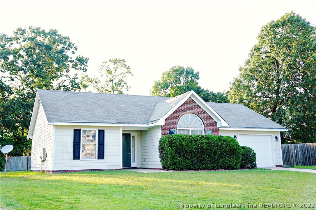 2940 Bakers Mill Road Fayetteville, NC 28306 - Photo 2 of 46 a front view of a house with a yard