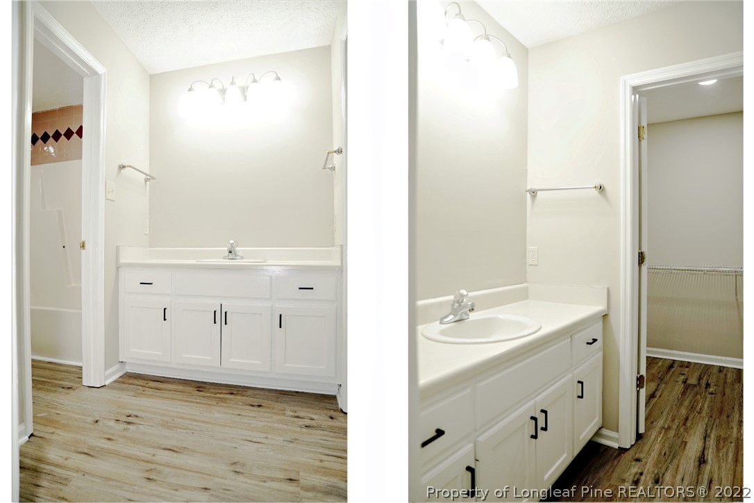 2940 Bakers Mill Road Fayetteville, NC 28306 - Photo 26 of 46 a bathroom with a sink a mirror and a shower