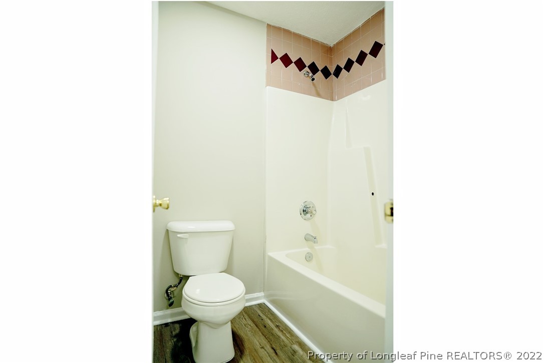 2940 Bakers Mill Road Fayetteville, NC 28306 - Photo 29 of 46 a bathroom with a toilet and a shower