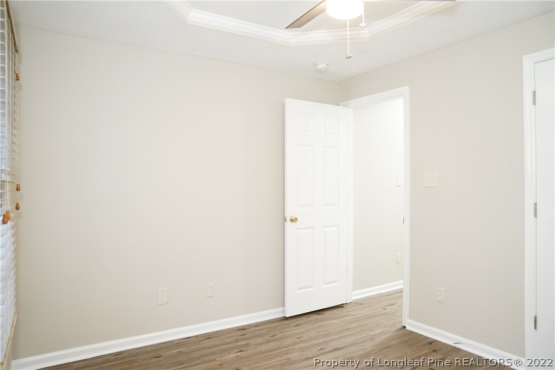 2940 Bakers Mill Road Fayetteville, NC 28306 - Photo 40 of 46 a view of an empty room with wooden floor