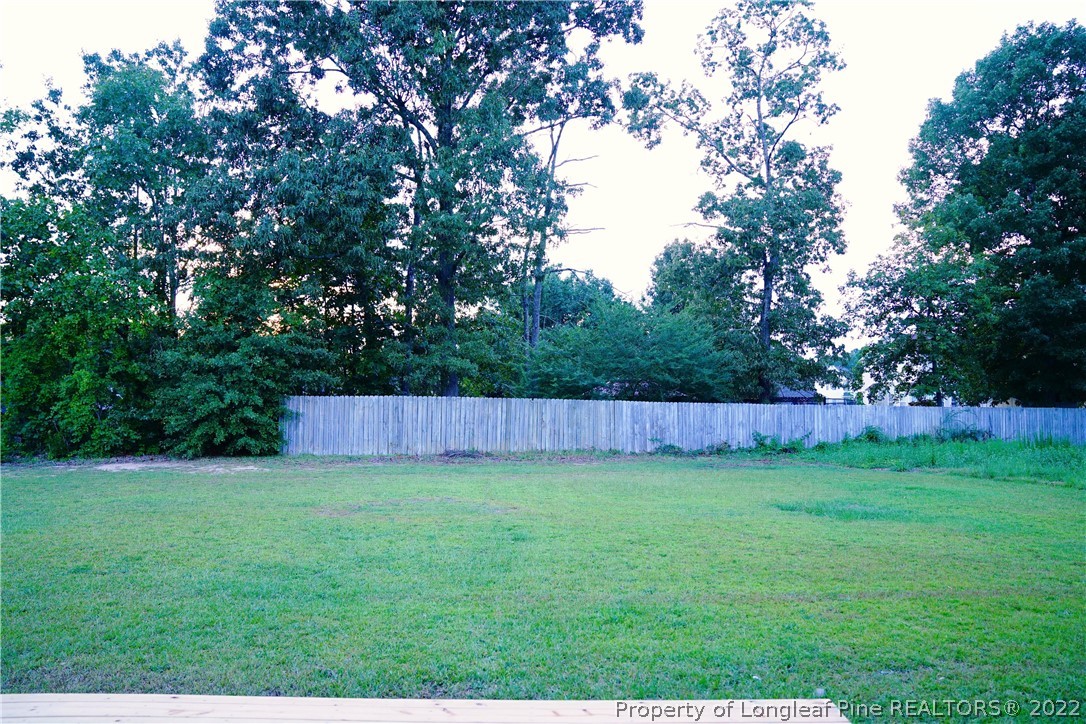 2940 Bakers Mill Road Fayetteville, NC 28306 - Photo 42 of 46 a view of yard with trees in the background